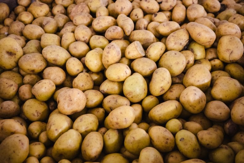 Lots of potatoes stacked together